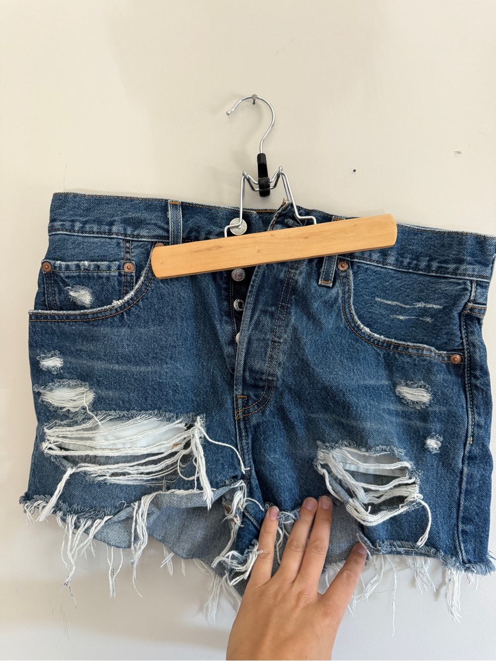 Levi's Distressed Dark Blue Denim Shorts with Frayed Hem